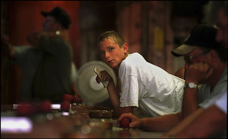 Boy playing Fascination, Knoebels Family Amusement Resort, Elysburg, Pennsylvania. Linda Johnson Photography, Linda Johnson Photographs.