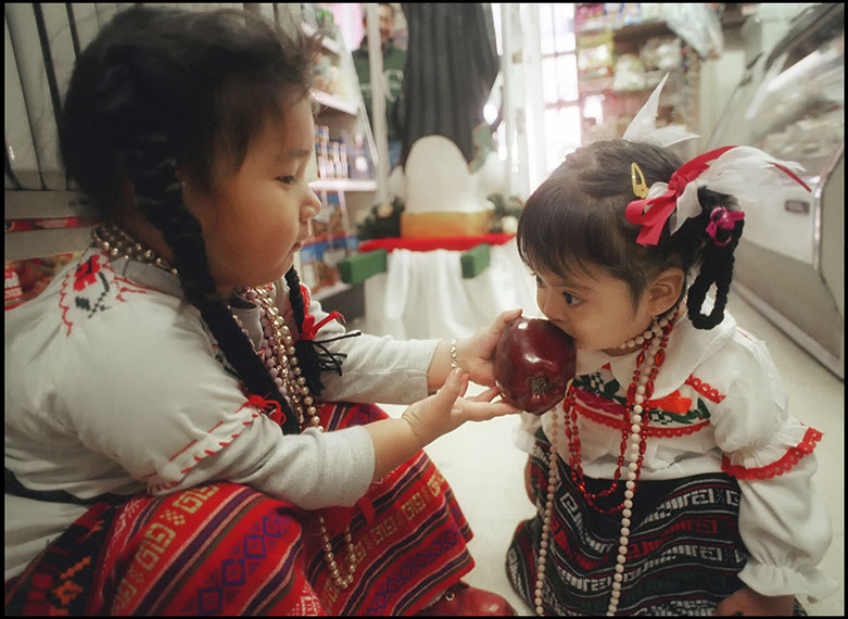 Two girls at a Mexican Grocery, Norristown, Pennsylvania. Linda Johnson Photography, Linda Johnson Photographs.