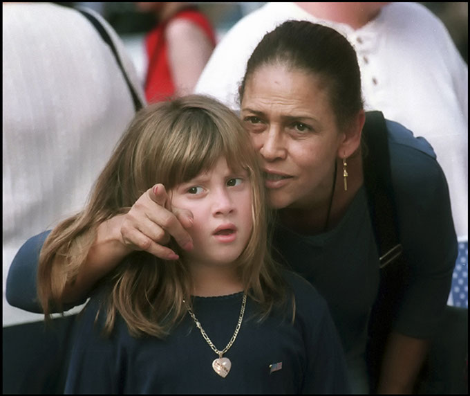 Woman and daughter look at remains of&nbsp; World Trade Center after 9/11/2001. Linda Johnson Photography, Linda Johnson Photographs.